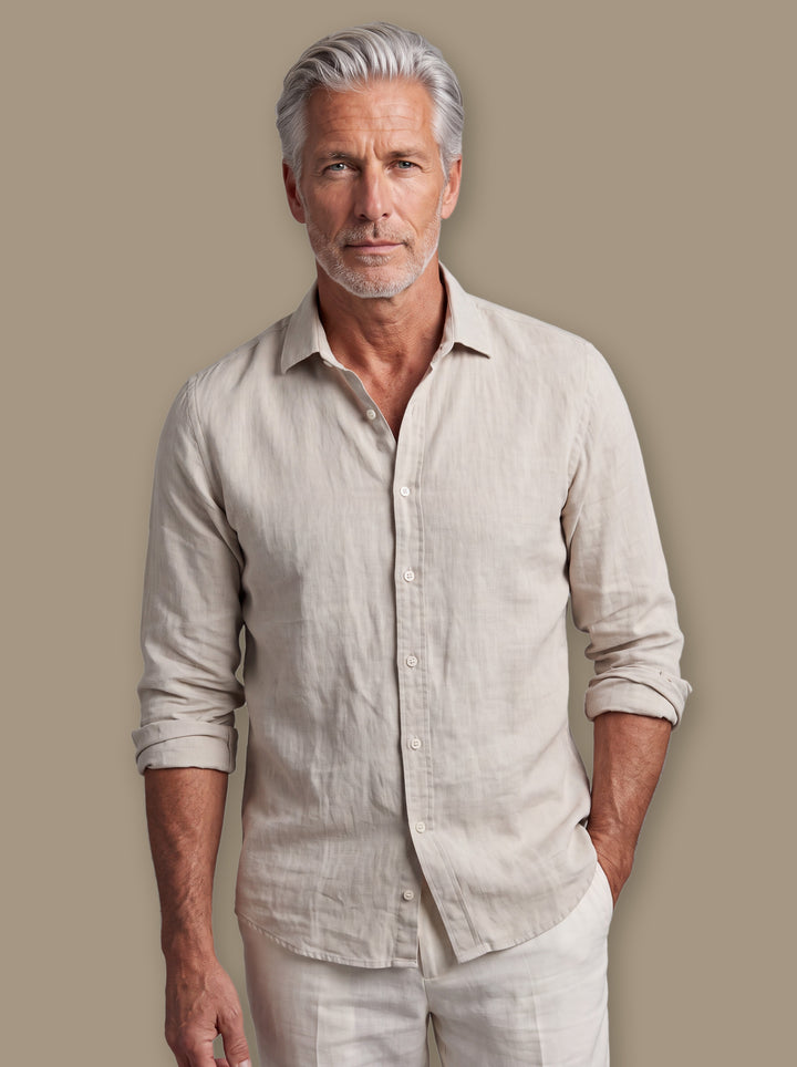 Burton linen shirt in Sand, worn by a model on a warm taupe studio background - Gentlemens Manor
