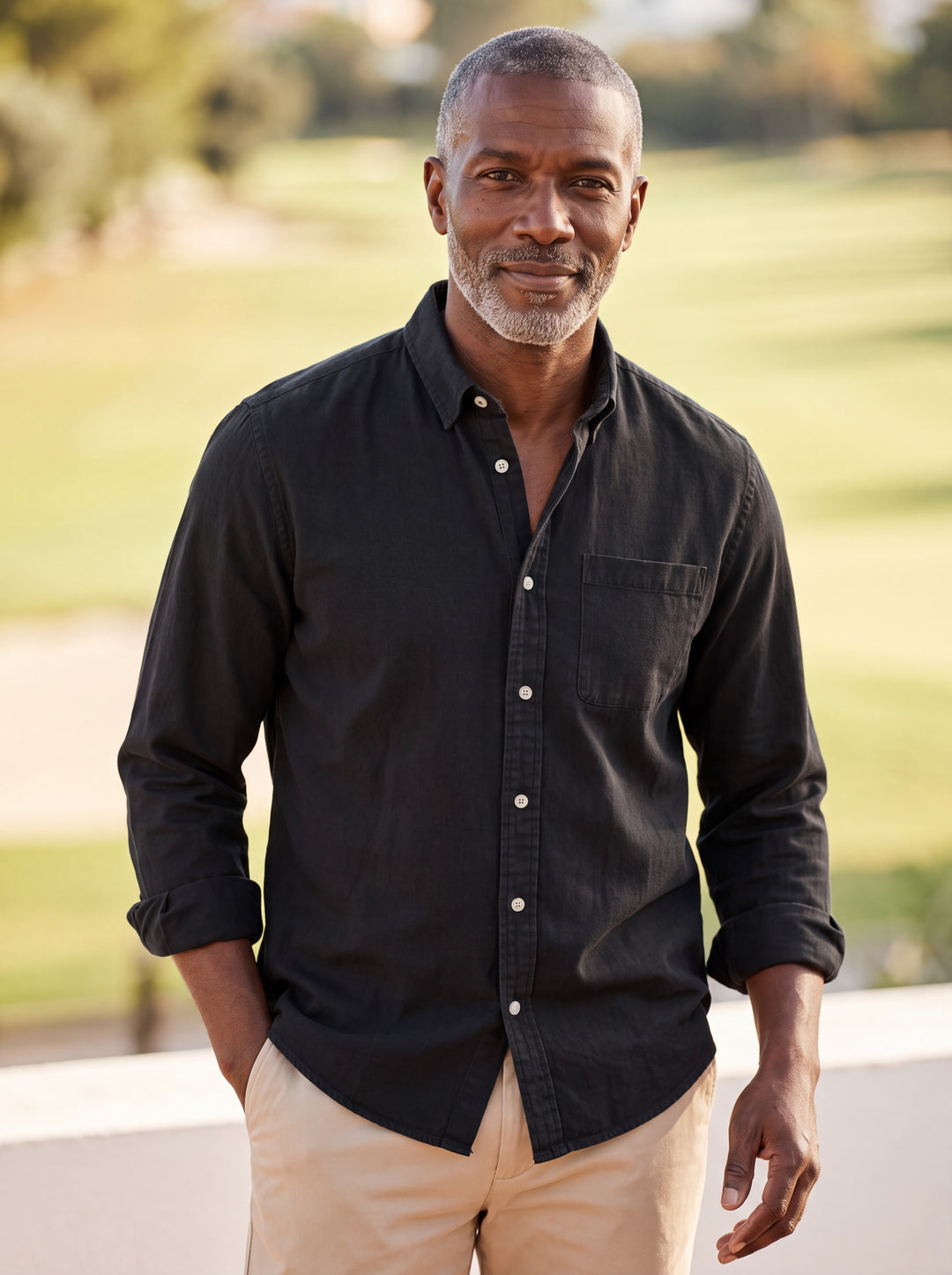 Byron shirt in Black, worn by a model in a Mediterranean setting - Gentlemens Manor lifestyle