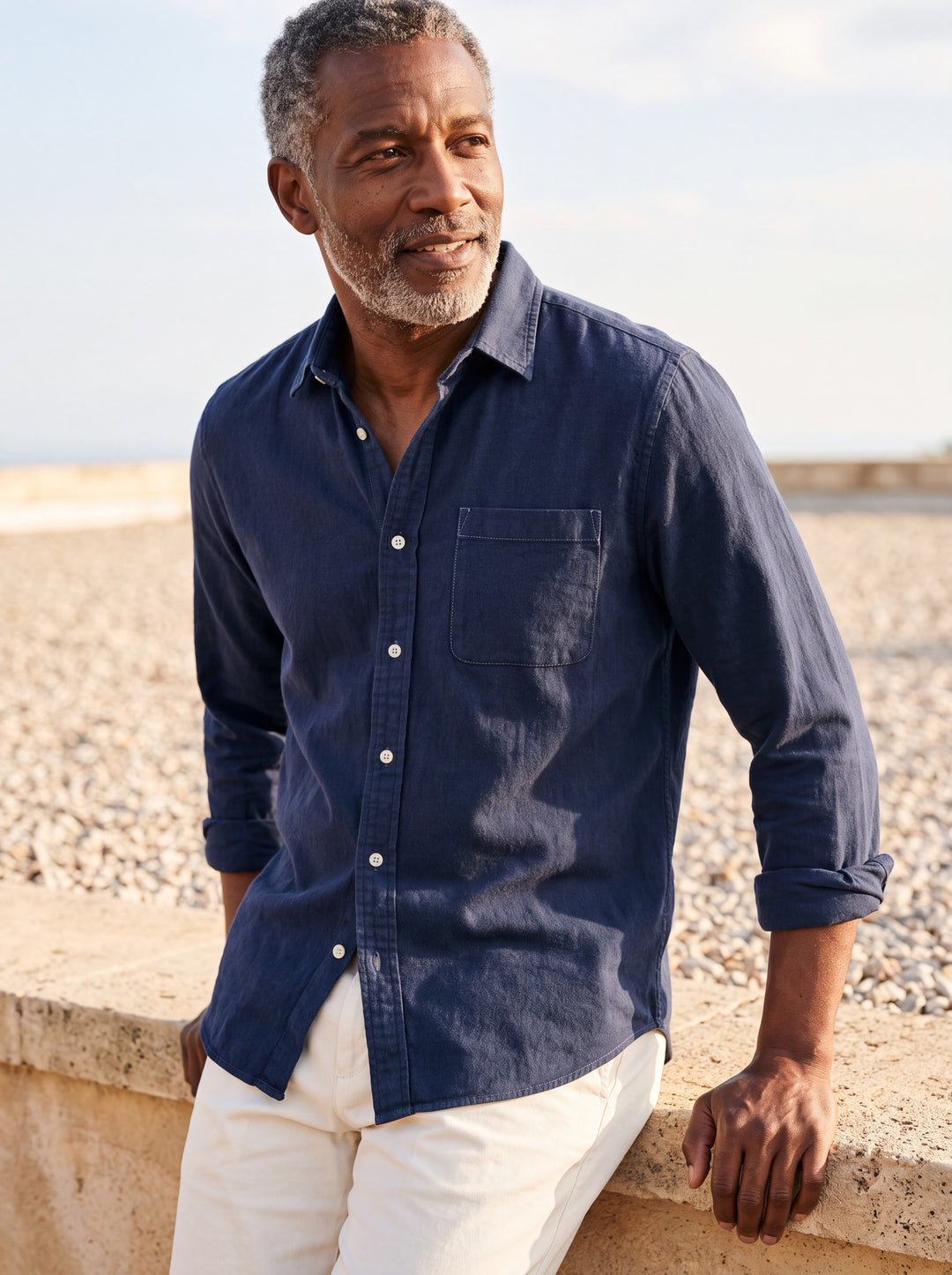 Byron shirt in Navy, worn by a model in a Mediterranean setting - Gentlemens Manor lifestyle