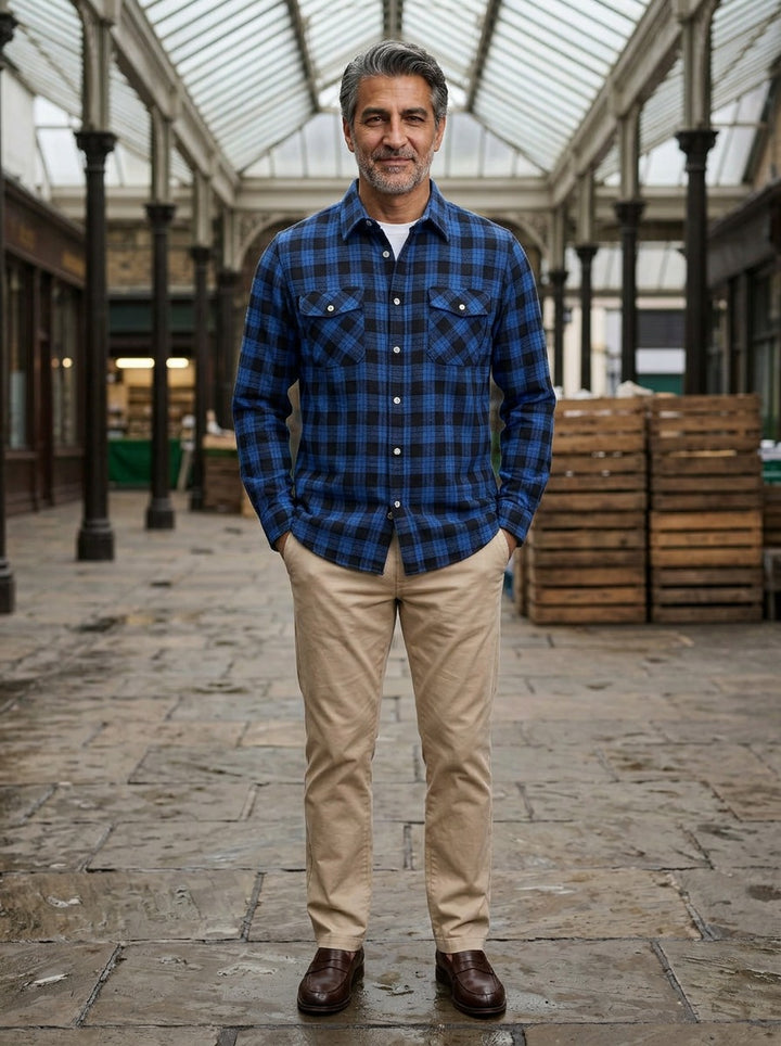 Cadwell plaid flannel shirt in Blue, lifestyle in a covered market hall, Gentlemens Manor