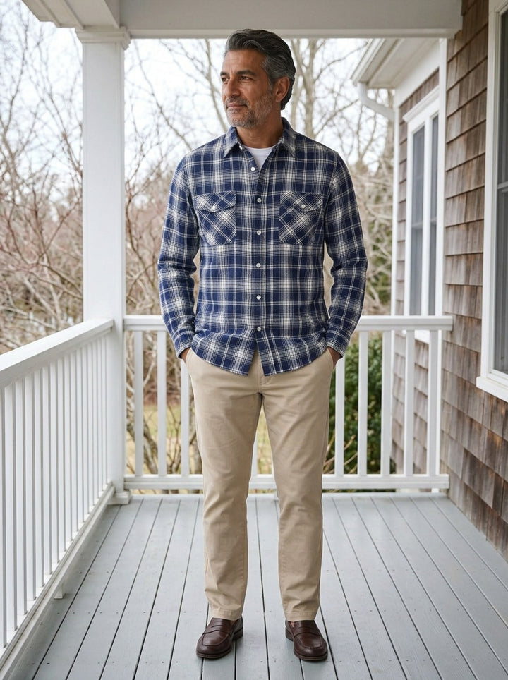 Cadwell plaid flannel shirt in Navy, lifestyle on a covered porch, Gentlemens Manor