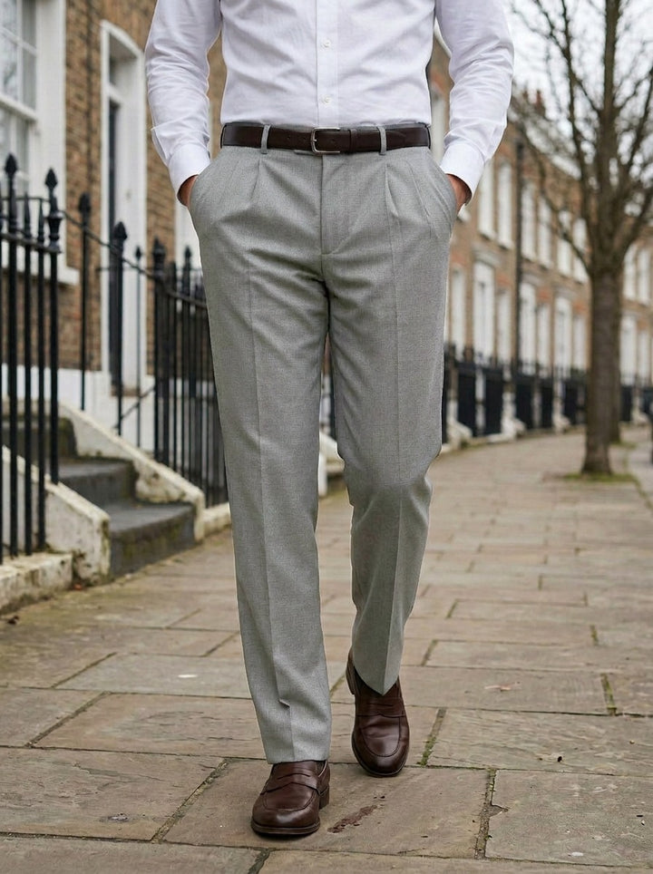Calder pleated dress pants in Grey, lifestyle on a street of brick row houses, Gentlemens Manor