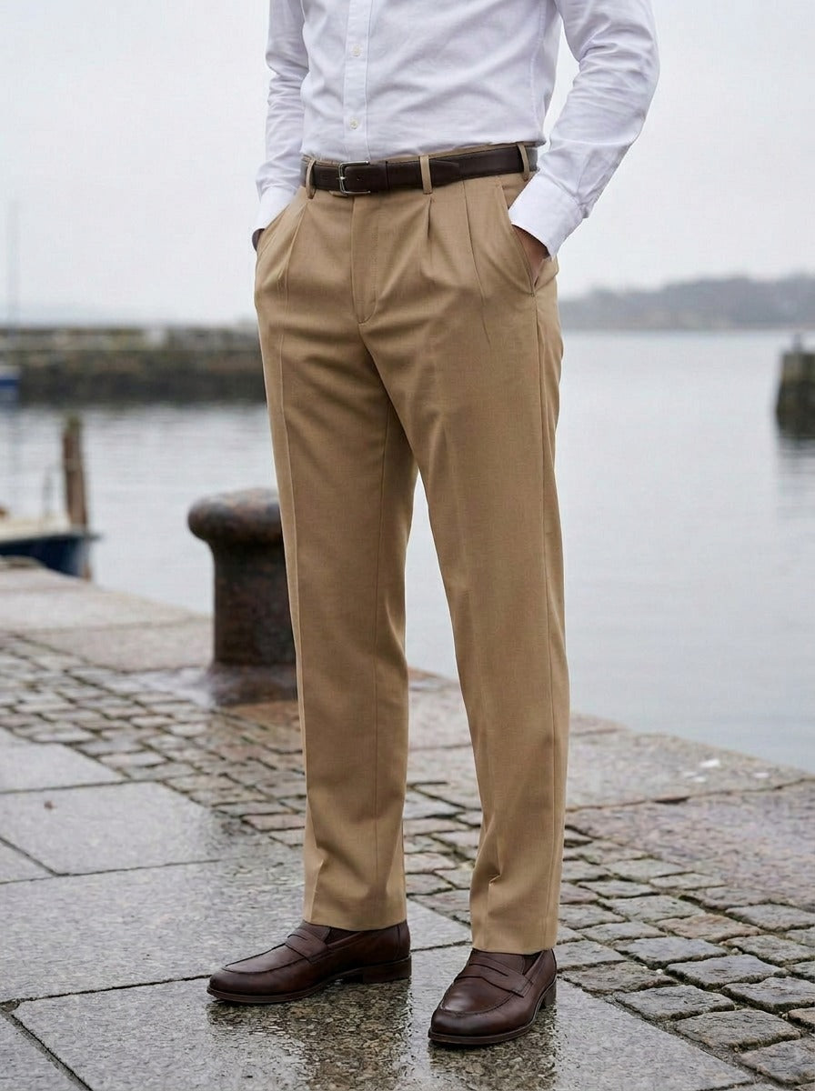 Calder pleated dress pants in Khaki, lifestyle on a stone harbor quay, Gentlemens Manor