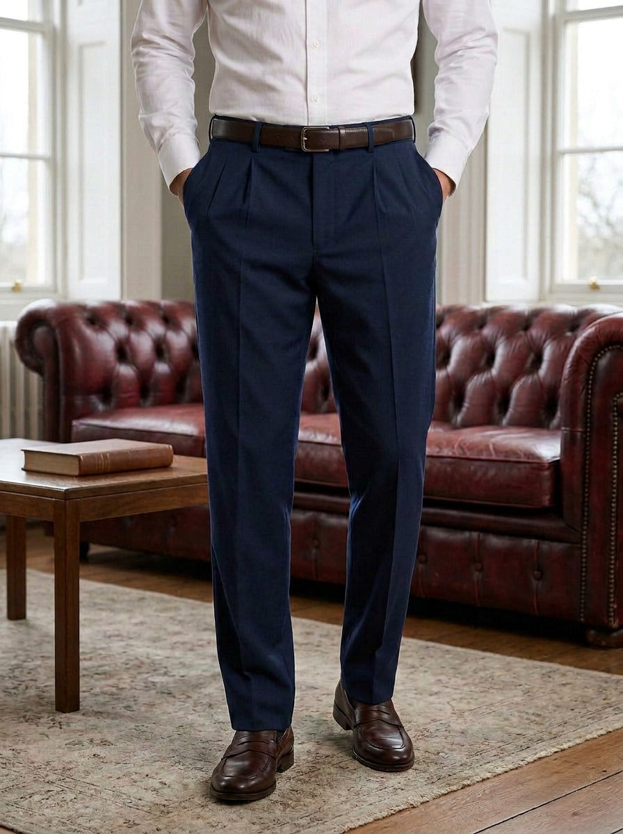 Calder pleated dress pants in Navy, lifestyle in a club reading room, Gentlemens Manor