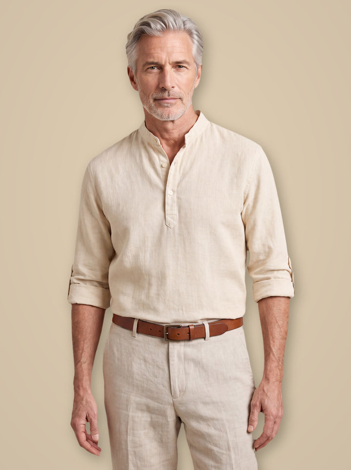 Caleb linen shirt in White, worn by a model on a warm taupe studio background - Gentlemens Manor