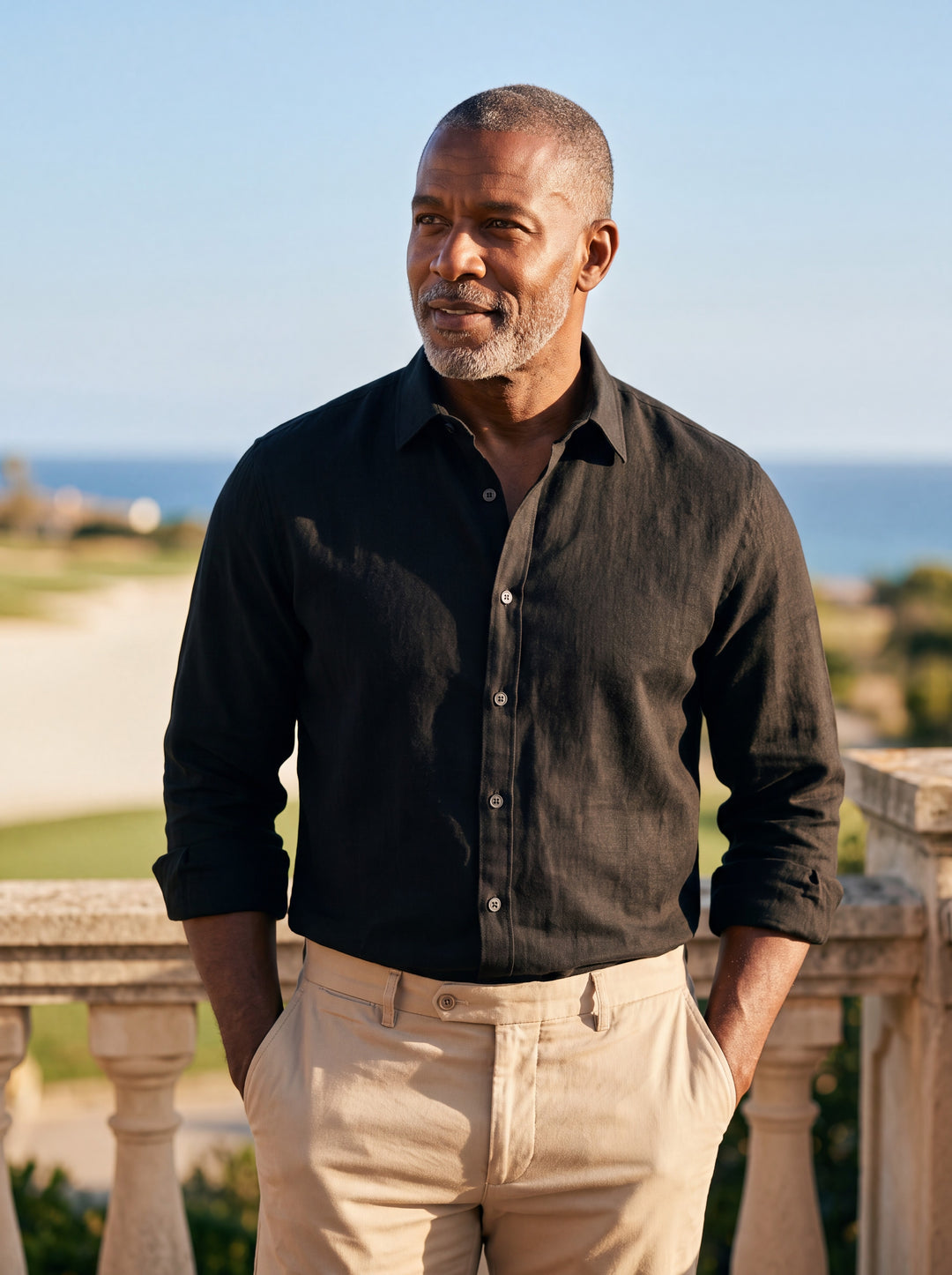 Calvin shirt in Black, worn by a model in a Mediterranean setting - Gentlemens Manor lifestyle