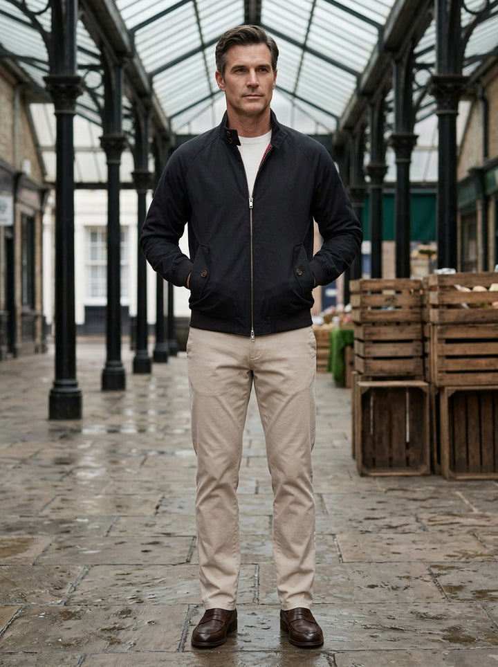 Camden tartan lined harrington jacket in Black, lifestyle in a covered market hall, Gentlemens Manor