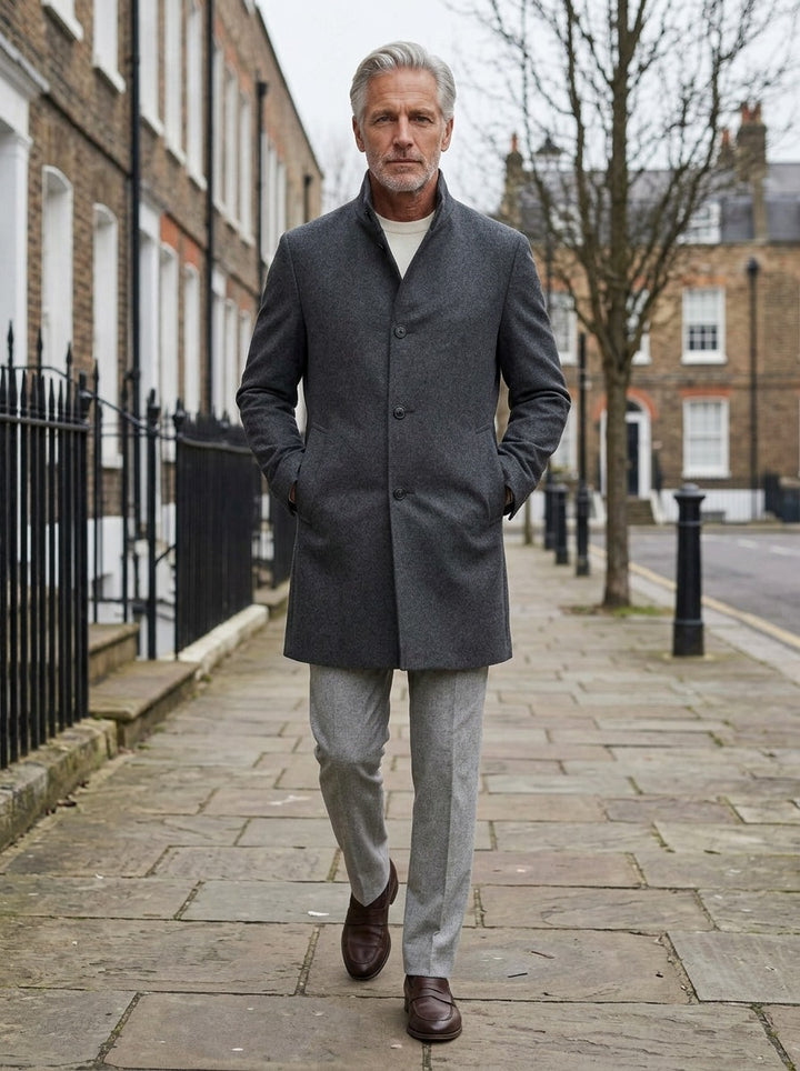 Carlisle coat in Charcoal, lifestyle on a street of brick row houses, Gentlemens Manor
