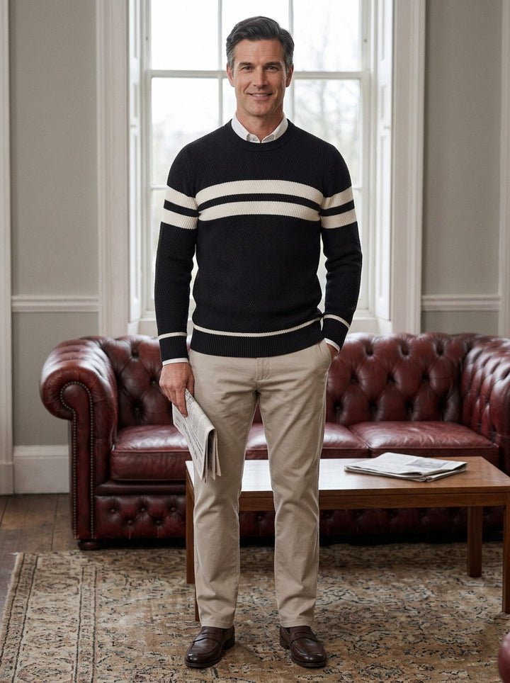 Carrington sweater in Black, lifestyle in a club reading room, Gentlemens Manor