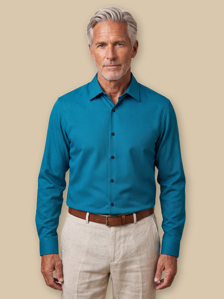 Carter casual shirt in Blue, worn by a model on a warm sand studio background - Gentlemens Manor