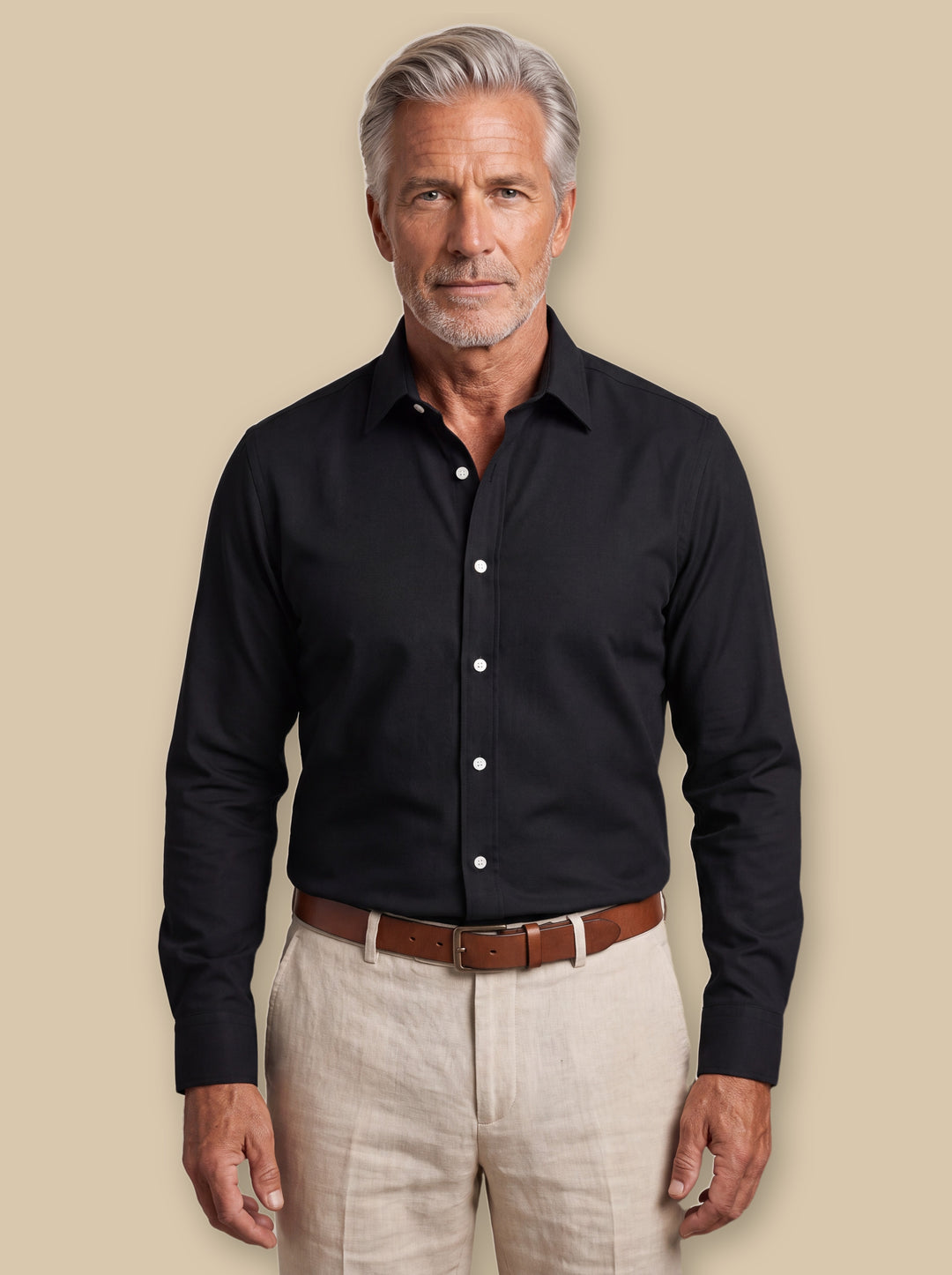 Cary casual shirt in Black, worn by a model on a warm sand studio background - Gentlemens Manor