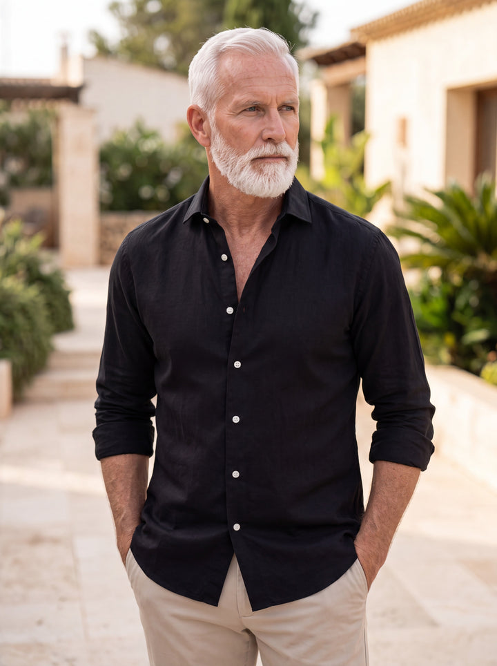 Cary shirt in Black, worn by a model in a Mediterranean setting - Gentlemens Manor lifestyle
