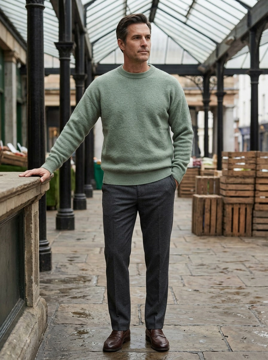 Channing sweater in Sage, lifestyle in a covered market hall, Gentlemens Manor