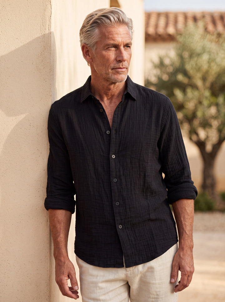 Chase shirt in Black, worn by a model in a Mediterranean setting - Gentlemens Manor lifestyle