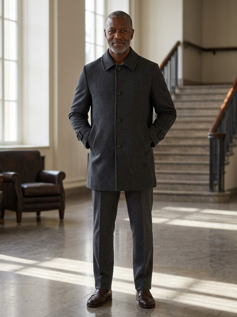 Chatham glen check car coat in Charcoal, lifestyle in a hotel lobby, Gentlemens Manor