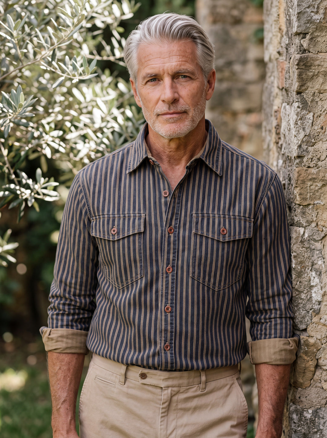 Chester shirt in Blue, worn by a model in a Mediterranean setting - Gentlemens Manor lifestyle