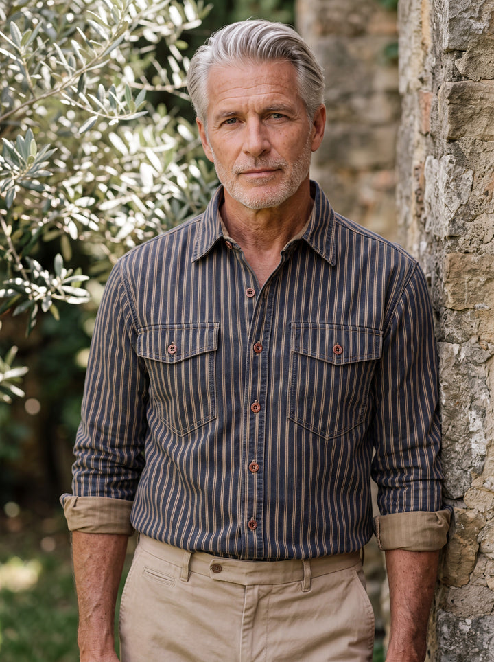 Chester shirt in Blue, worn by a model in a Mediterranean setting - Gentlemens Manor lifestyle