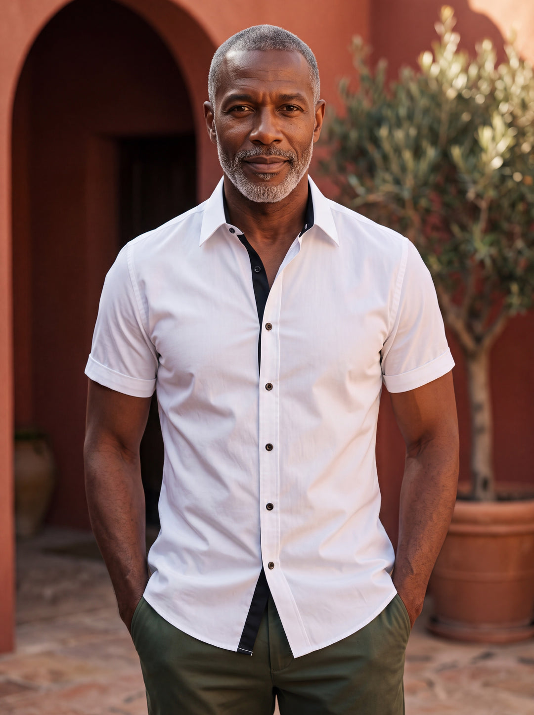 Clark shirt in White, worn by a model in a Mediterranean setting - Gentlemens Manor lifestyle