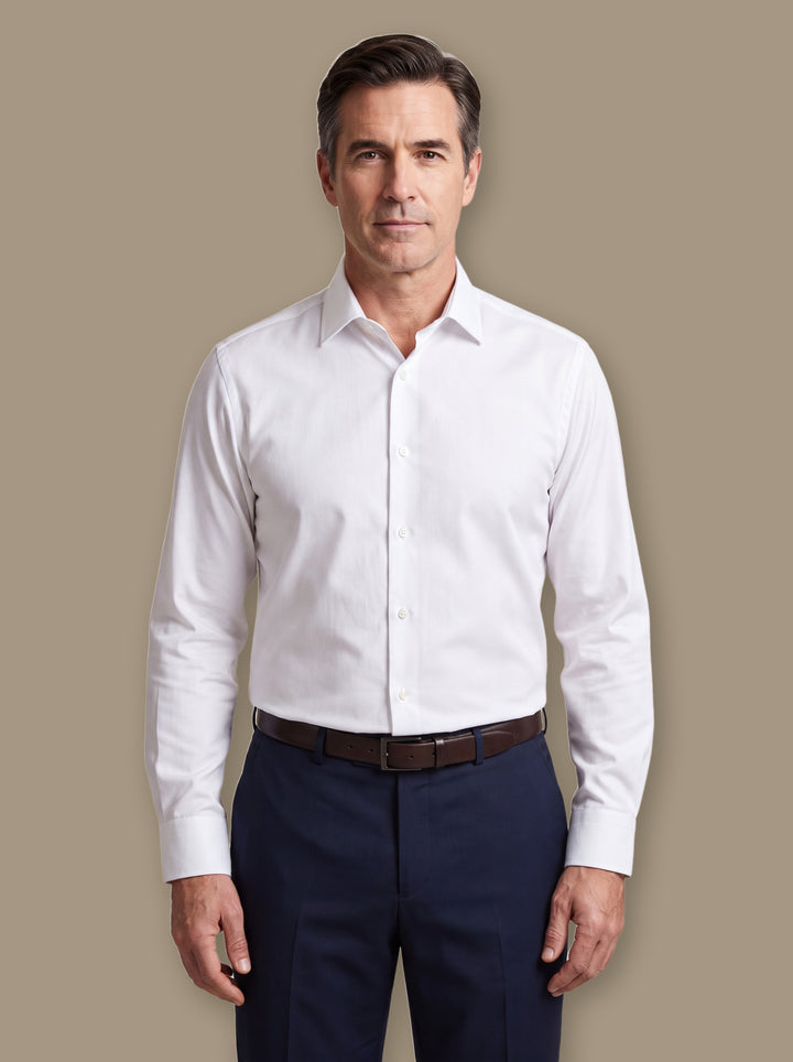 Claude dress shirt in White, worn by a model on a warm taupe studio background - Gentlemens Manor