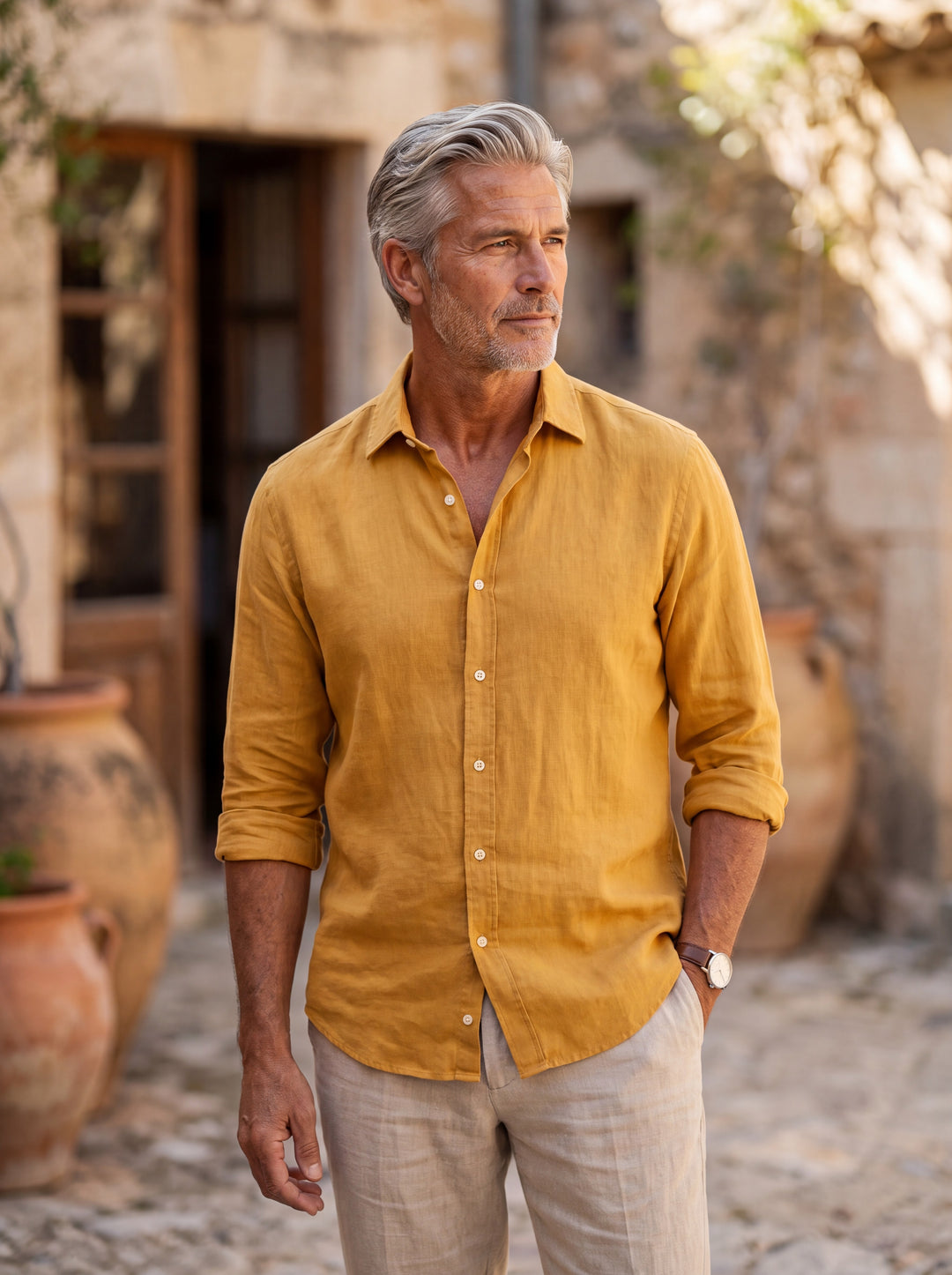 Clement Men linen shirt in Mustard, worn by a model on a Mediterranean terrace - Gentlemens Manor lifestyle