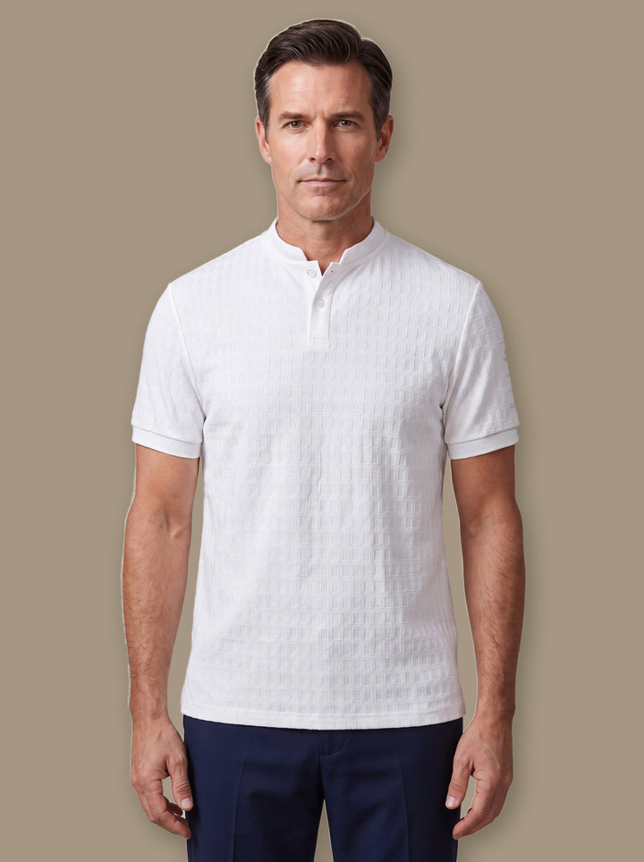 Clifford polo shirt in White, worn by a model on a warm taupe studio background - Gentlemens Manor