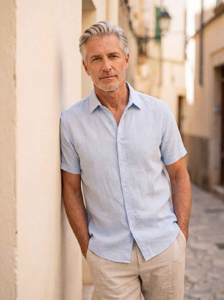 Cole Men short sleeve shirt in Light Blue, worn by a model on a Mediterranean terrace - Gentlemens Manor lifestyle