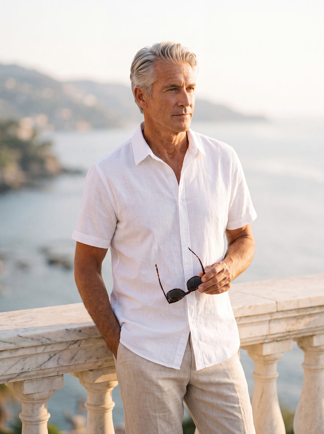 Cole Men short sleeve shirt in white, worn by a model on a Mediterranean terrace - Gentlemens Manor lifestyle