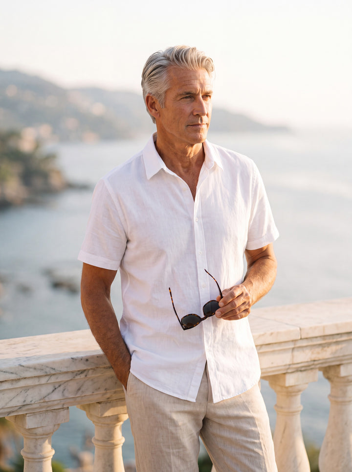 Cole Men short sleeve shirt in white, worn by a model on a Mediterranean terrace - Gentlemens Manor lifestyle
