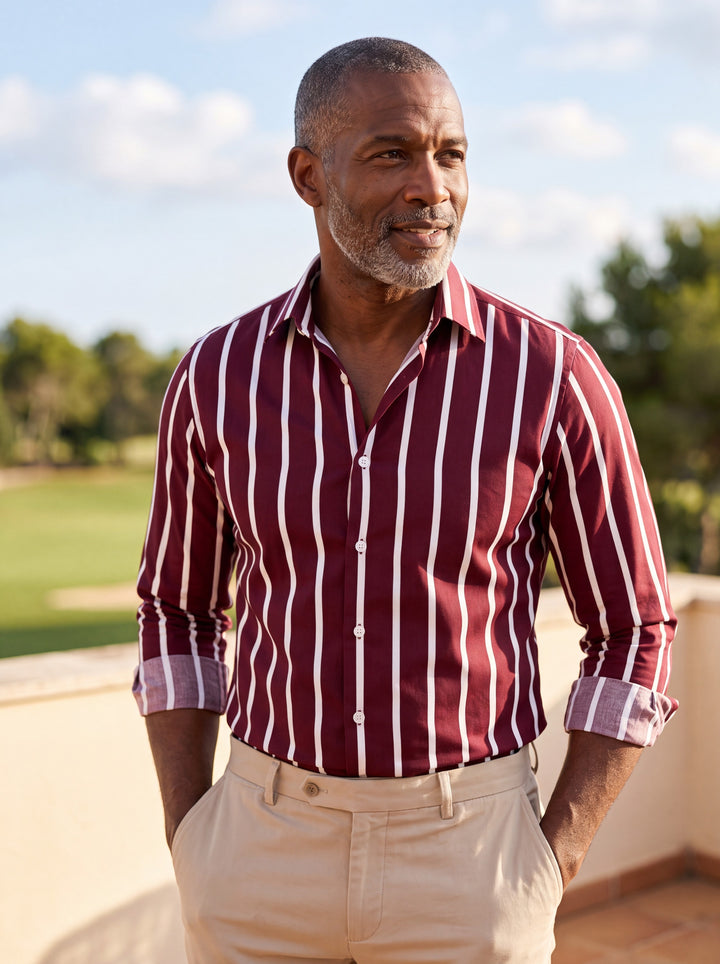 Colton shirt in Burgundy, worn by a model in a Mediterranean setting - Gentlemens Manor lifestyle