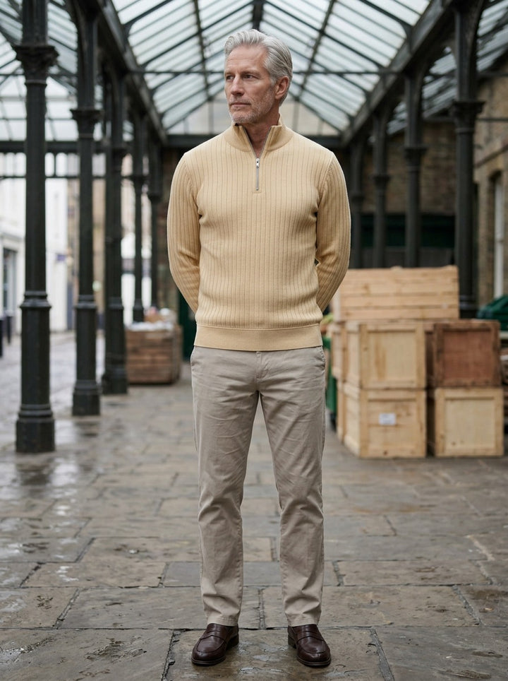 Colwyn half zip sweater in Beige, lifestyle in a covered market hall, Gentlemens Manor
