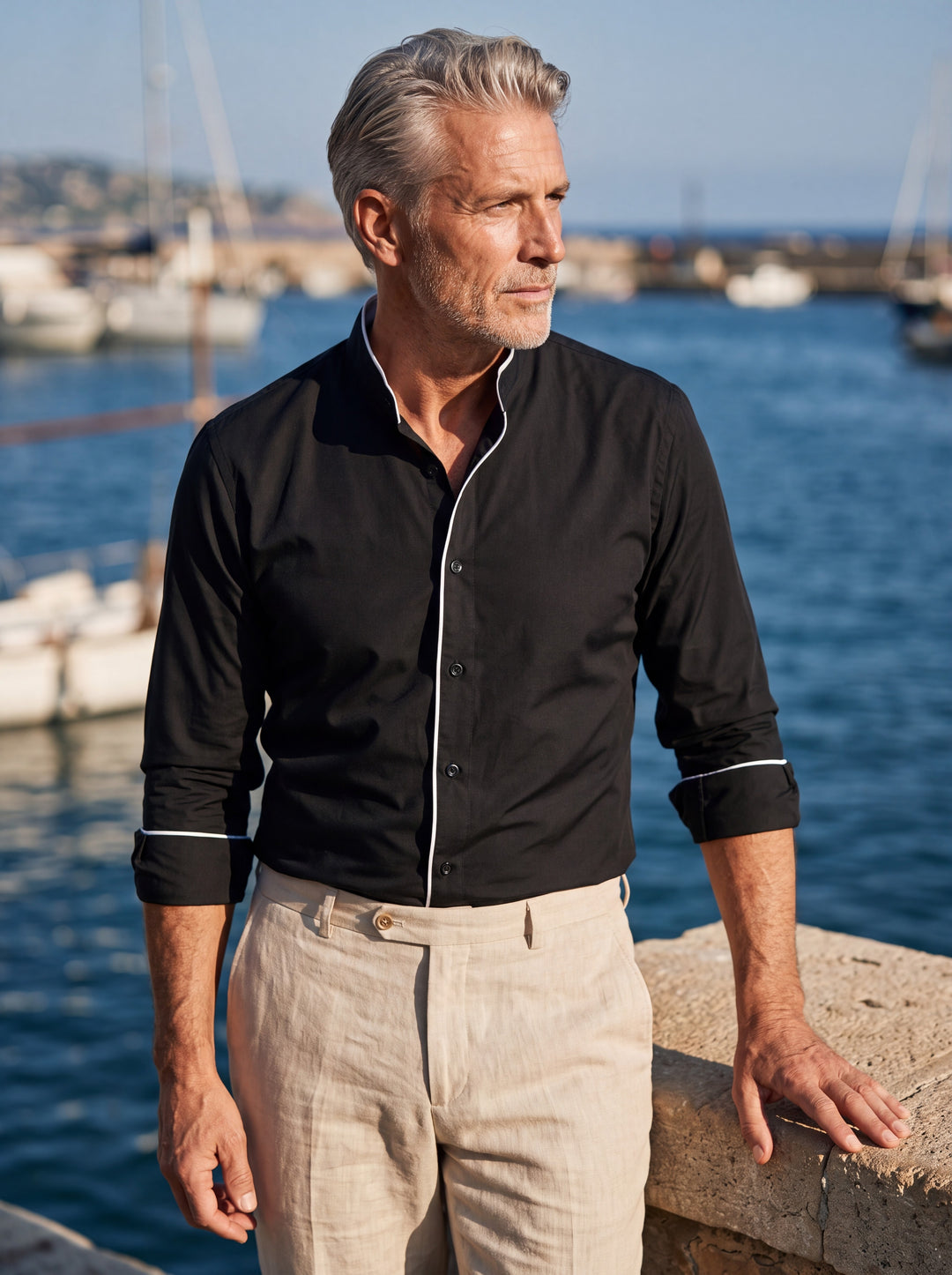 Conrad shirt in Black, worn by a model in a Mediterranean setting - Gentlemens Manor lifestyle