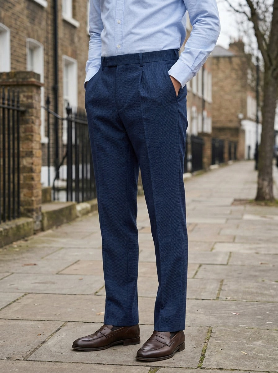 Conway basketweave pleated trousers in Navy, lifestyle on a street of brick row houses, Gentlemens Manor