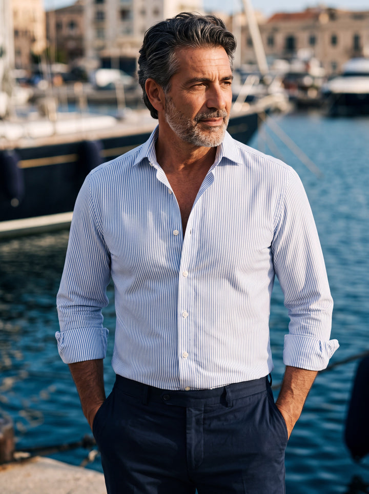 Cooper shirt in Light Blue, worn by a model in a Mediterranean setting - Gentlemens Manor lifestyle