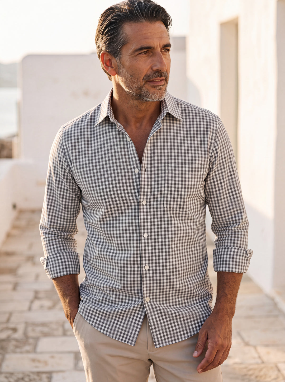 Cornelius shirt in Grey, worn by a model in a Mediterranean setting - Gentlemens Manor lifestyle