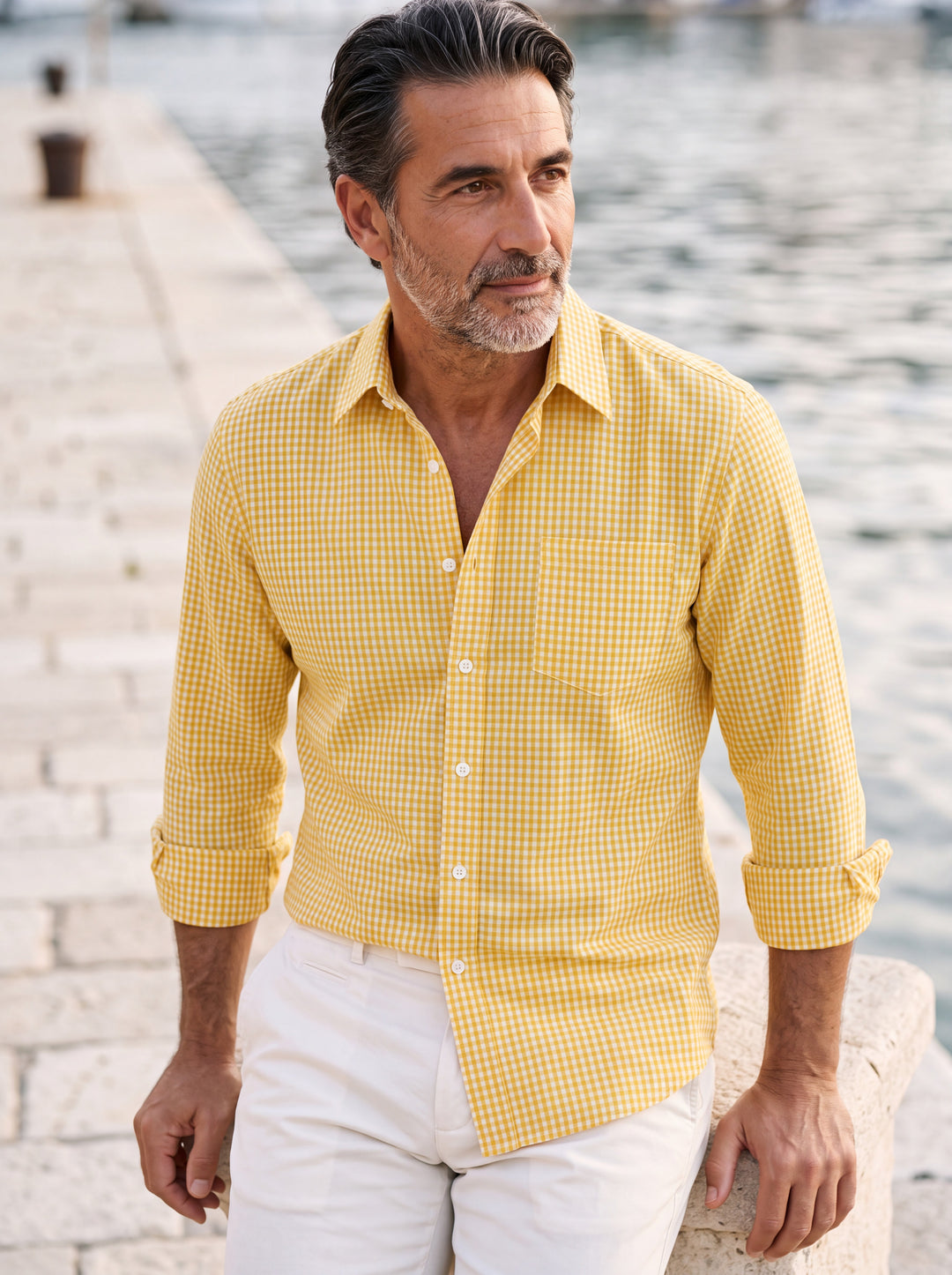 Cornelius shirt in Mustard, worn by a model in a Mediterranean setting - Gentlemens Manor lifestyle