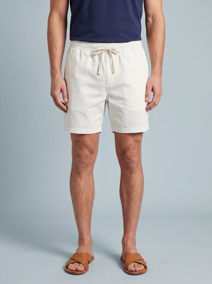 Crawford summer shorts in White, worn by a model on a soft blue studio background, Gentlemens Manor