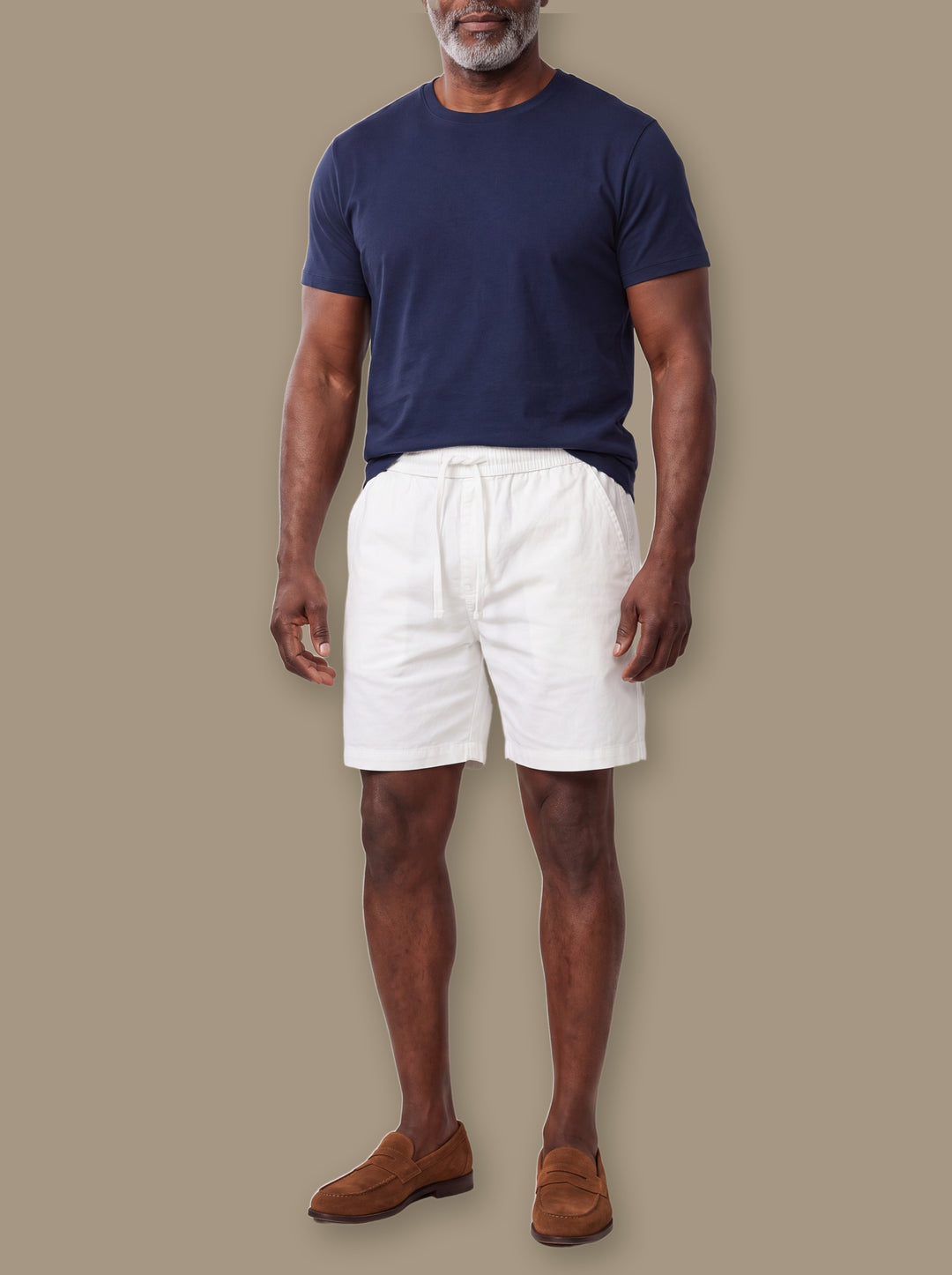 Crawford summer shorts in White, worn by a model on a warm taupe studio background - Gentlemens Manor