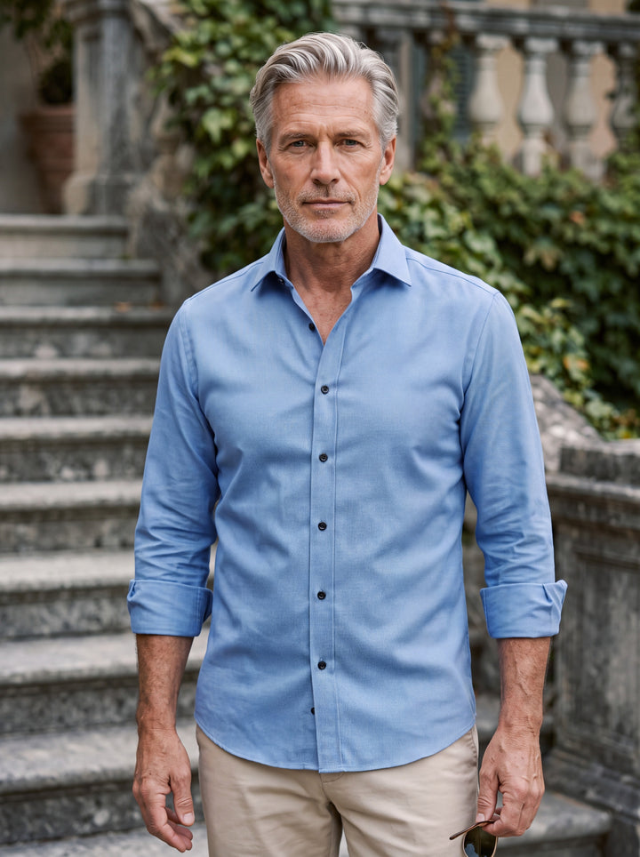 Curtis shirt in Blue, worn by a model in a Mediterranean setting - Gentlemens Manor lifestyle