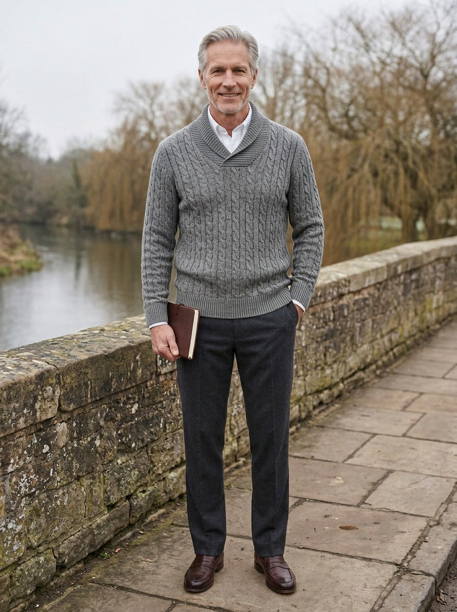 Dalby cable knit shawl collar sweater in Grey, lifestyle on a stone footbridge, Gentlemens Manor