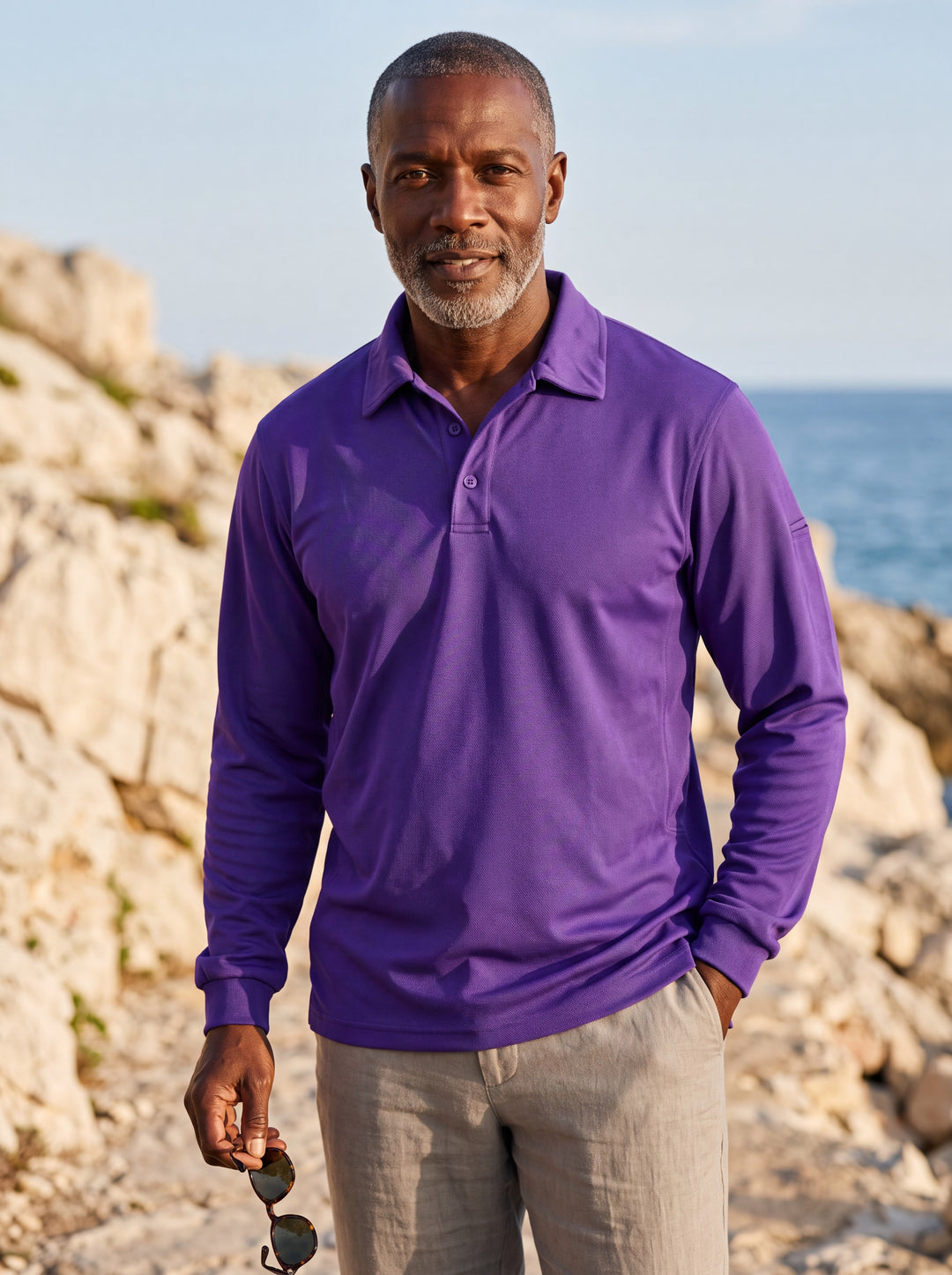 Dalton Men polo shirt in purple, worn by a model on a Mediterranean terrace - Gentlemens Manor lifestyle