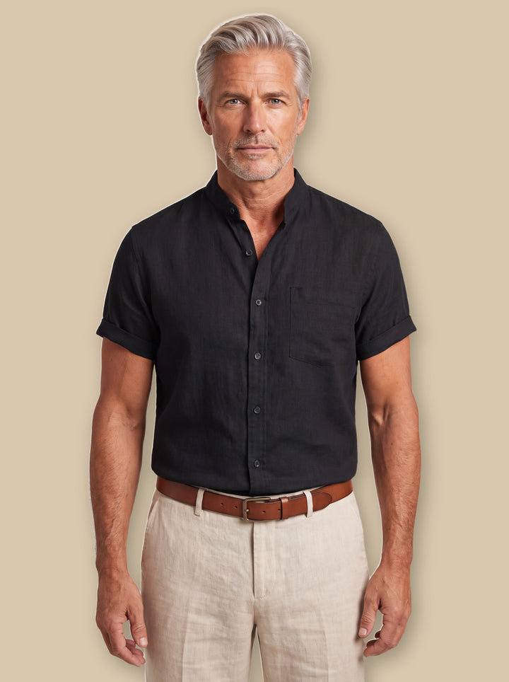 Dana beach shirt in Black, worn by a model on a warm sand studio background - Gentlemens Manor