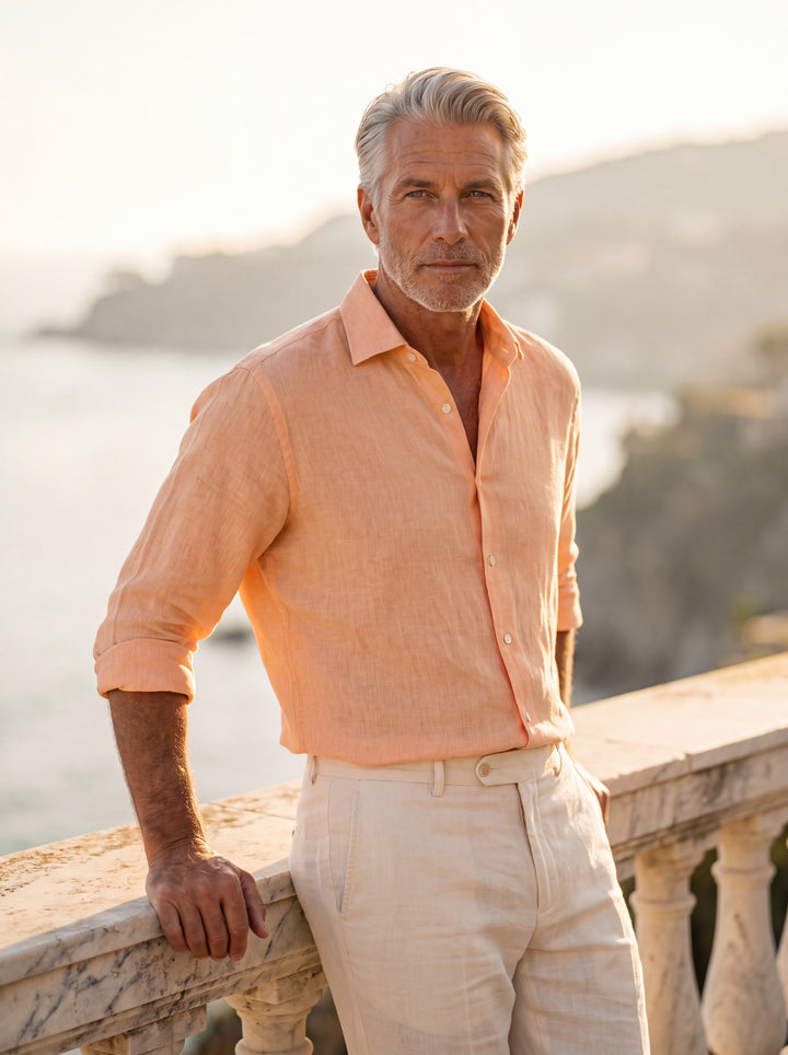 Dane Men linen shirt in Cream, worn by a model on a Mediterranean terrace - Gentlemens Manor lifestyle