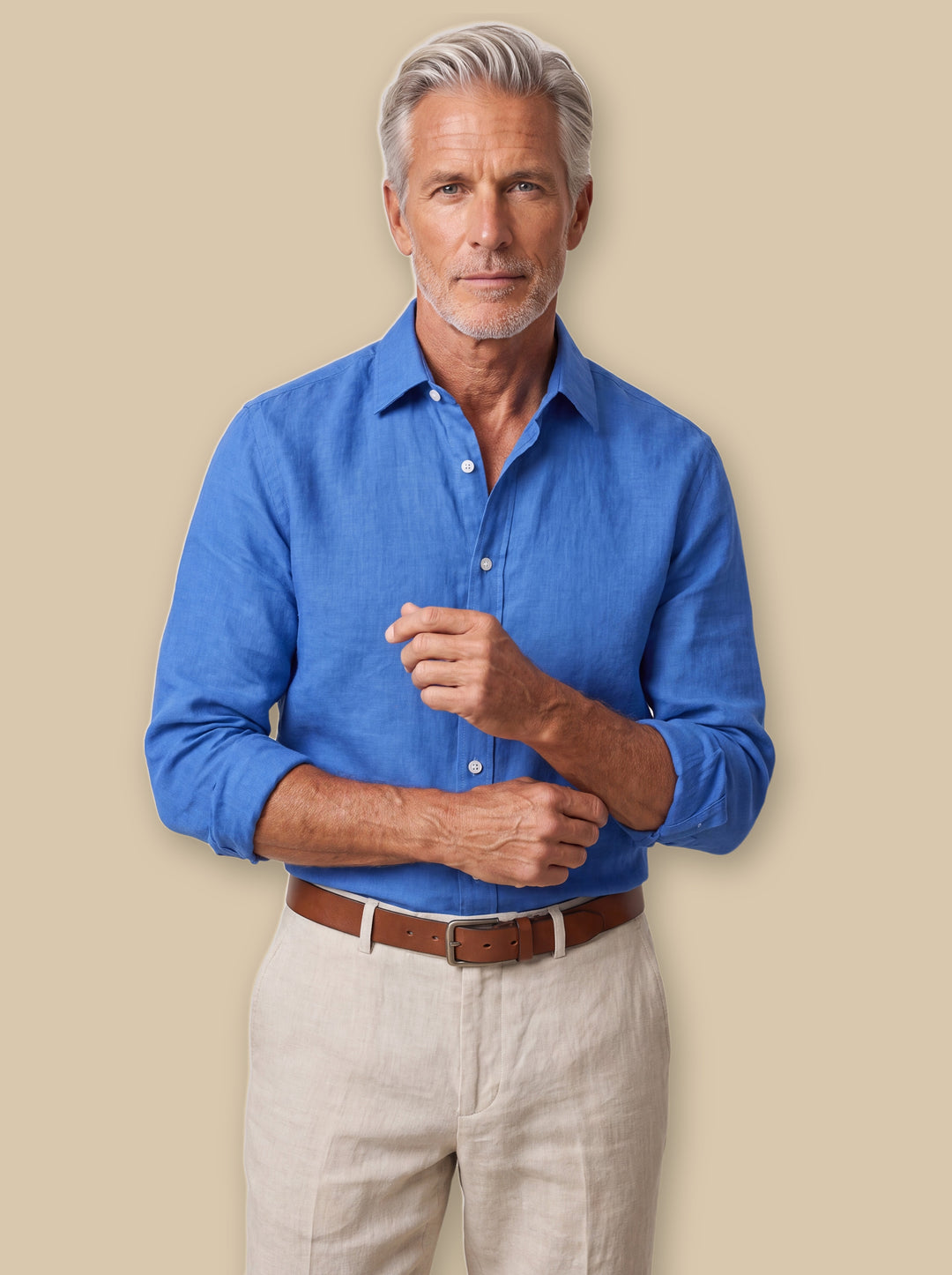 Daniel linen shirt in Blue, worn by a model on a warm sand studio background - Gentlemens Manor