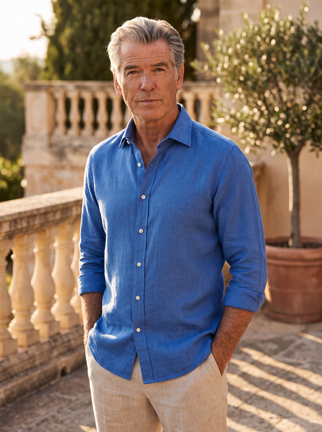 Daniel Men linen shirt in Blue, worn by a model on a Mediterranean terrace - Gentlemens Manor lifestyle
