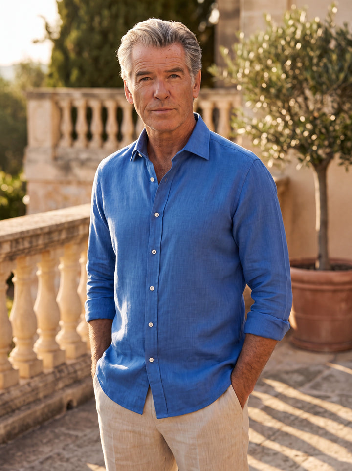 Daniel Men linen shirt in Blue, worn by a model on a Mediterranean terrace - Gentlemens Manor lifestyle