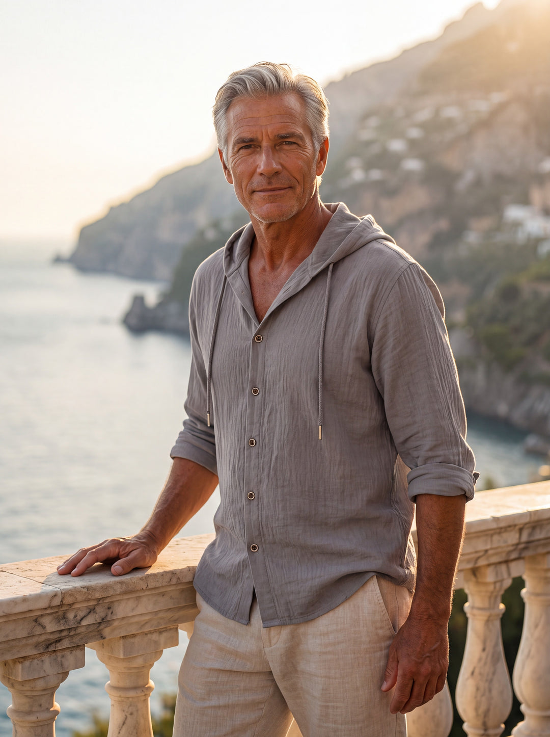 Dawson Men linen shirt in Grey, worn by a model on a Mediterranean terrace - Gentlemens Manor lifestyle