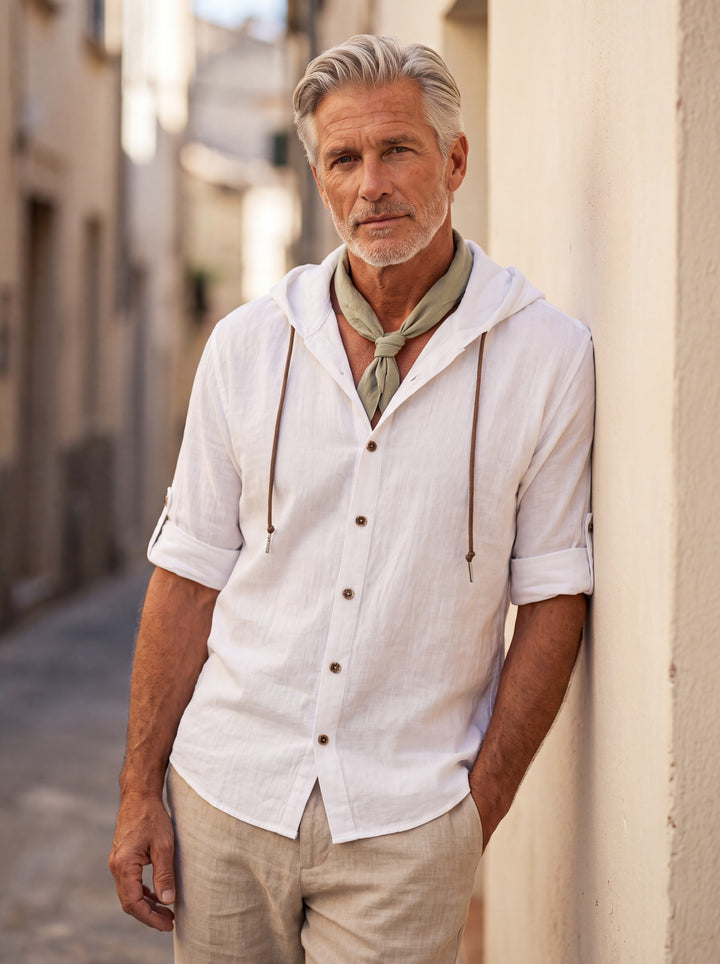 Dawson Men linen shirt in white, worn by a model on a Mediterranean terrace - Gentlemens Manor lifestyle