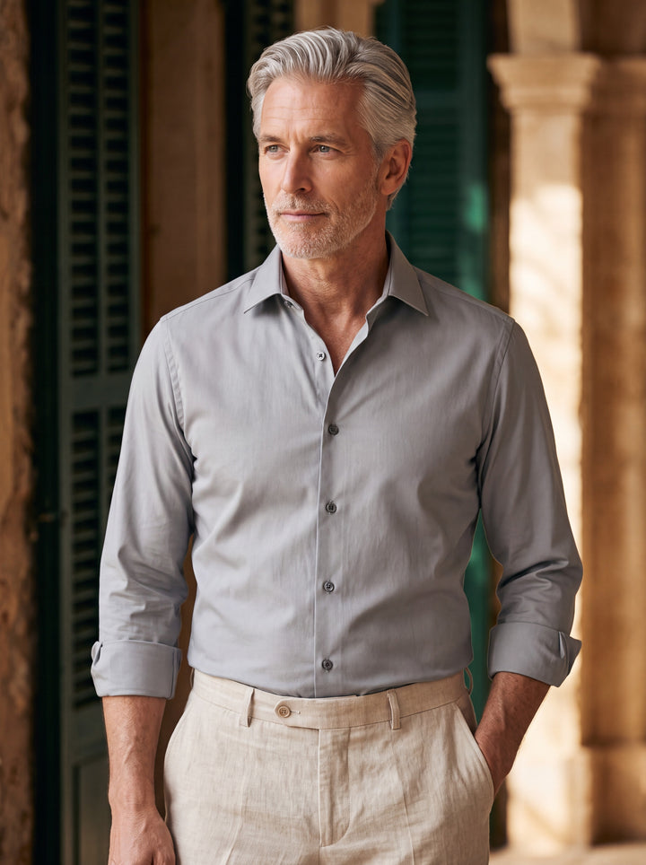 Desmond shirt in Grey, worn by a model in a Mediterranean setting - Gentlemens Manor lifestyle