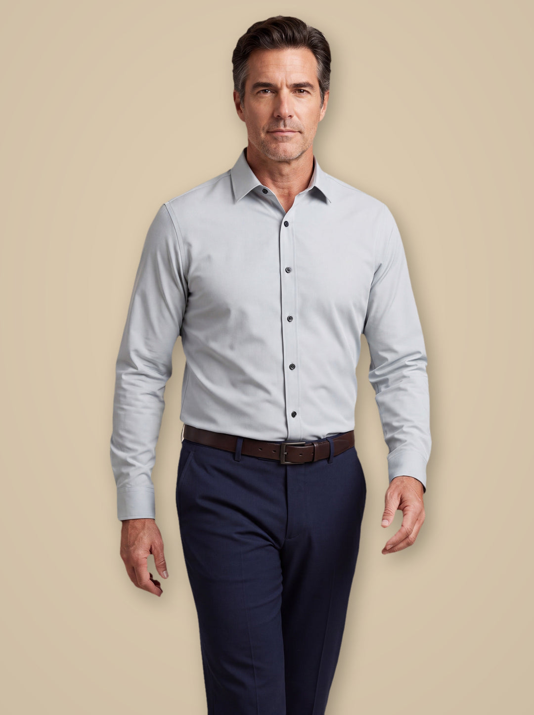 Desmond dress shirt in Light Grey, worn by a model on a warm taupe studio background - Gentlemens Manor