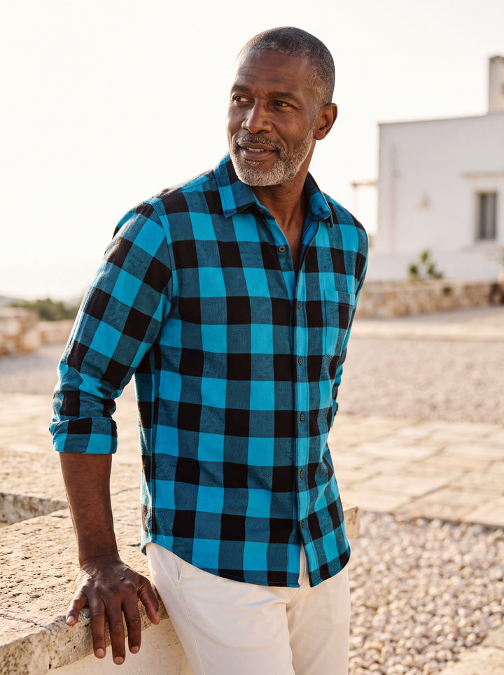 Dominic shirt in Blue, worn by a model in a Mediterranean setting - Gentlemens Manor lifestyle